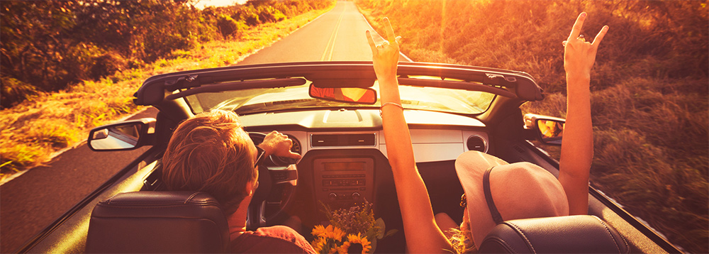 Couple in Convertible at Sunset