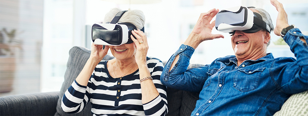Senior Couple Wearing Virtual Reality Goggles