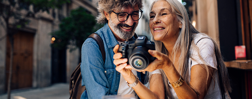 Senior Couple on Vacation with Camera