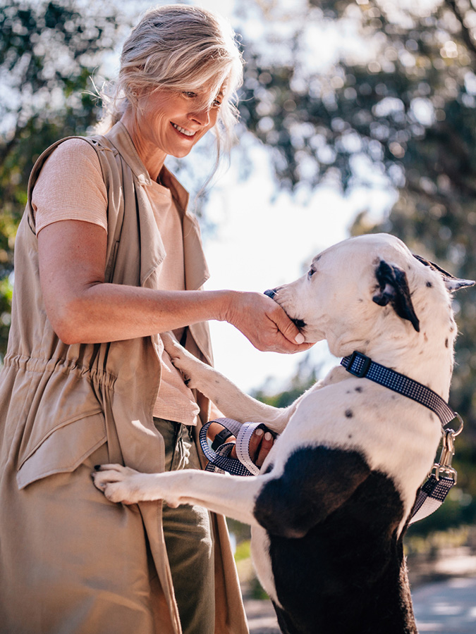 Woman Petting Dog
